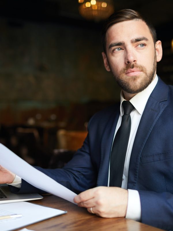 successful-business-consultant-with-papers-r7jtkarbjrcalanbu89a0pop4ddofeh09izdm2zsjk